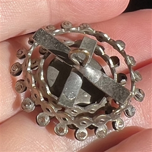 Very unusual multi-colored flashed glass set in metal “wheels button.