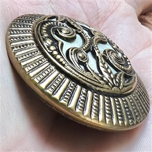 Victorian stamped brass over celluloid.