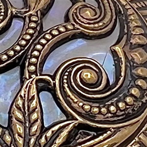 Victorian stamped brass over celluloid.