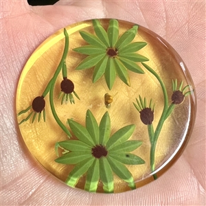 Vintage reverse carved apple juice Bakelite button of flowers.