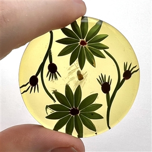 Vintage reverse carved apple juice Bakelite button of flowers.