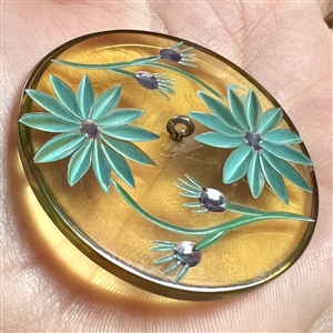 Vintage reverse carved apple juice Bakelite button of flowers.