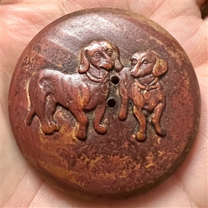 Wood button of dachshunds.