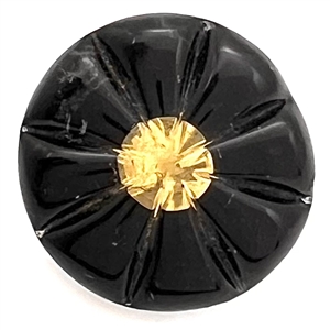 Starburst kaleidoscope button with molded radial top.