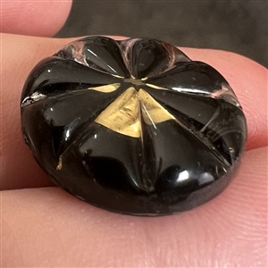 Starburst kaleidoscope button with molded radial top.
