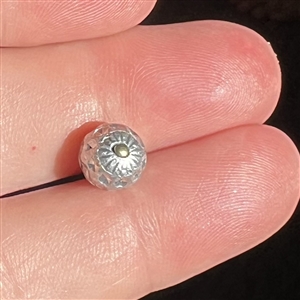 Diminutive size aluminum ball button.