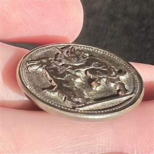 Unusual mythology button of a satyr and dancing goat.