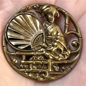 Brass button of “Madame Chrysanthemum.