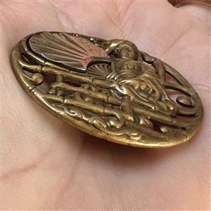 Brass button of “Madame Chrysanthemum.