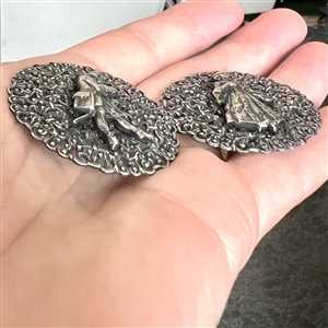 Two French white metal buttons of a courting couple.