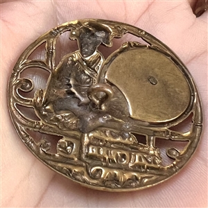 Brass button of “Madame Chrysanthemum.