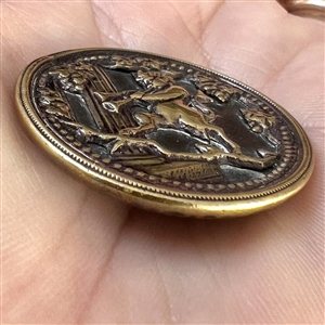 Brass button of “Satyr with Pan pipes.