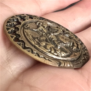 “Boar Hunter Brass button with wood background.