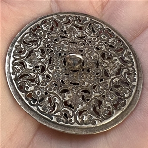 Silvered brass button of cupid.