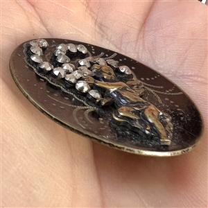 Brass button of “Winged Creature.