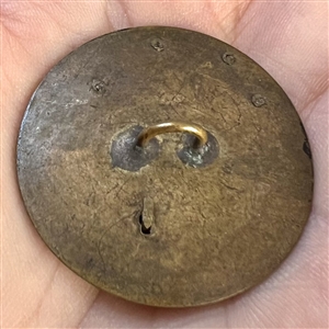Brass button of “Winged Creature.