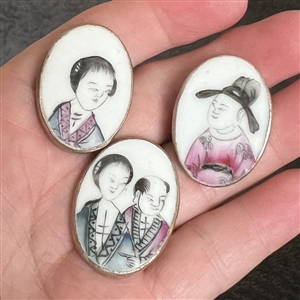 Three shard ceramic buttons of Asian men and women. 