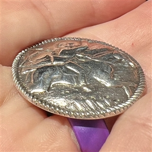 Dutch silver button of hunter riding horse with deer in background.