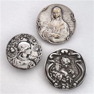Three metal buttons of women, with one of them by Armond Bargas.