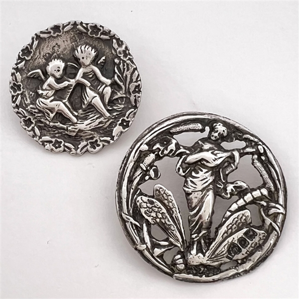 Two Hallmarked silver buttons with mythological themes. 