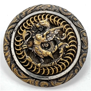 Brass button of a dragon standing.