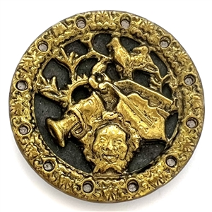 Brass button of mans head with many objects around him.