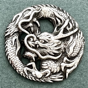 Silver Asian dragon button.
