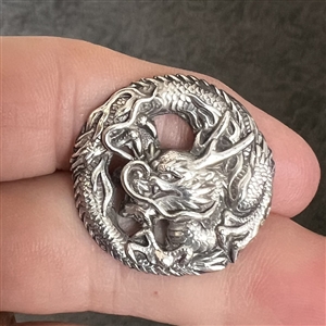 Silver Asian dragon button.