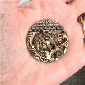 Fantastic brass Chinese dragon under a pagoda with steels button. 