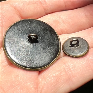Two purple tinted brass buttons of “Phaethon in mother daughter sizes. 