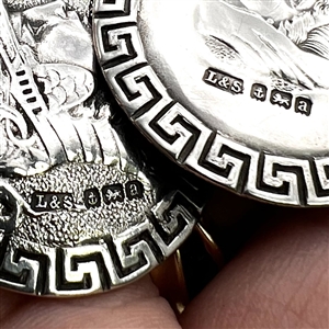 Two Hallmarked silver buttons of heads.