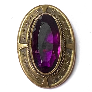 Gay 90s faceted amethyst glass set in metal button.