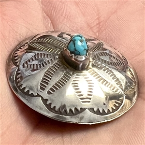 Native American silver button with chunk turquoise center.