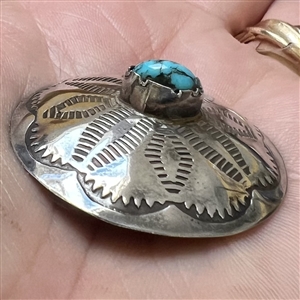 Native American silver button with chunk turquoise center.