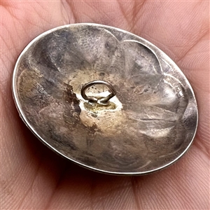 Native American silver button with chunk turquoise center.