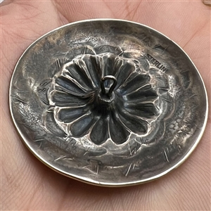 Native American silver button.