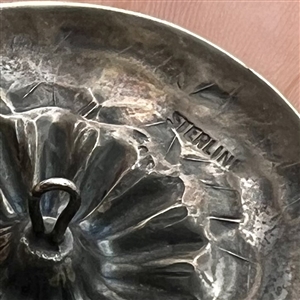Native American silver button.
