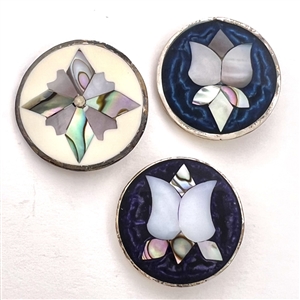 Three Mother of pearl and abalone inlay in Mexican silver buttons of flowers.
