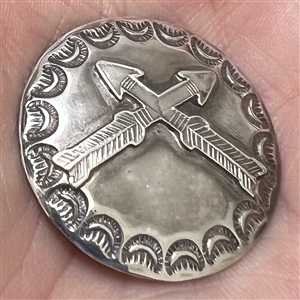 Modern Native American silver button of crossed arrows.