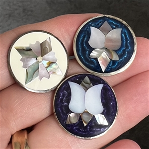 Three Mother of pearl and abalone inlay in Mexican silver buttons of flowers.