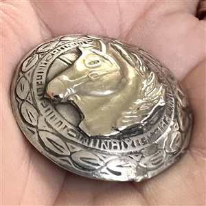 Modern Native American silver button of a horse head.