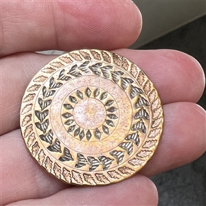 An 18th c. heavily chased copper Colonial button.