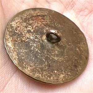 An 18th c. heavily chased copper Colonial button.