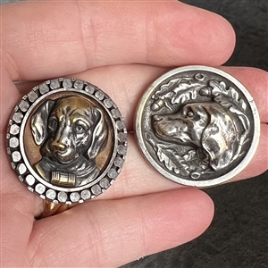 Two buttons of dog heads. 