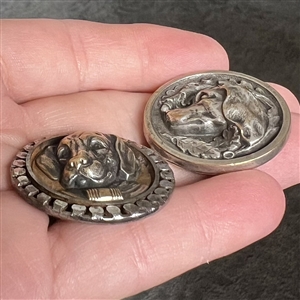 Two buttons of dog heads. 