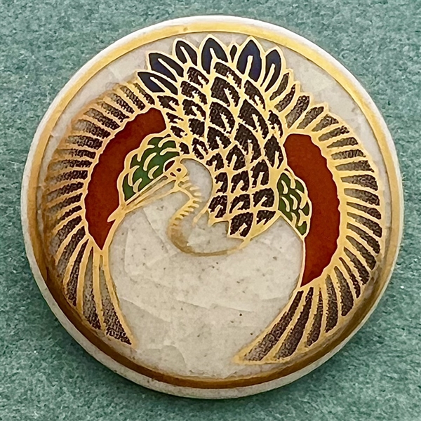 Modern Satsuma button of a flying crane. 