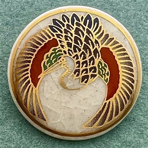 Modern Satsuma button of a flying crane. 