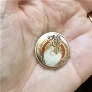 Modern Satsuma button of a flying crane. 