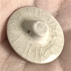 Modern Satsuma button of a flying crane. 