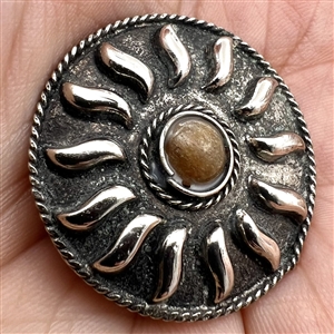 Four assorted Mexican and Native American silver buttons.